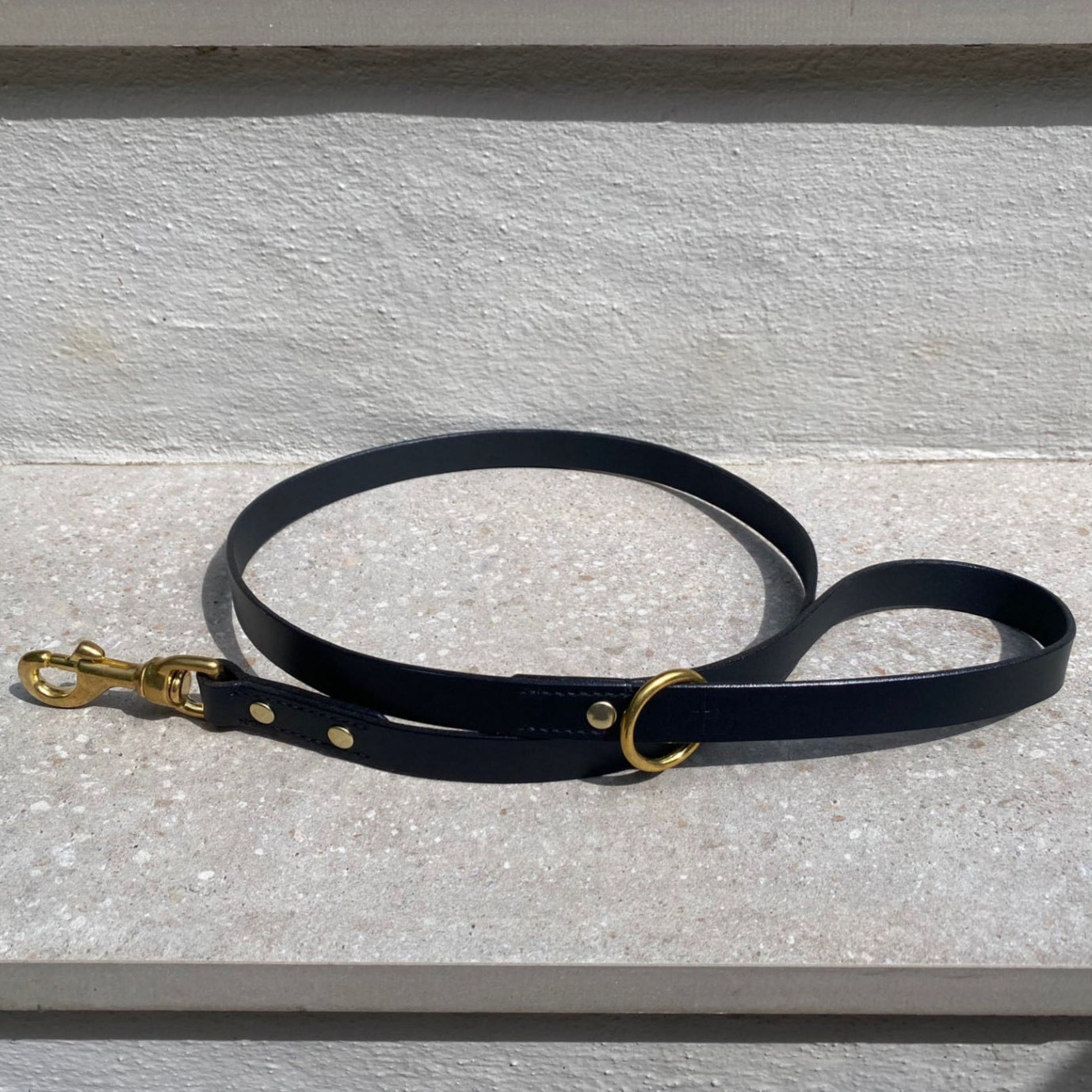 Black lead against a stone background